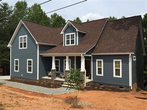 grey house brown metal roof|exterior paint for brown roof.